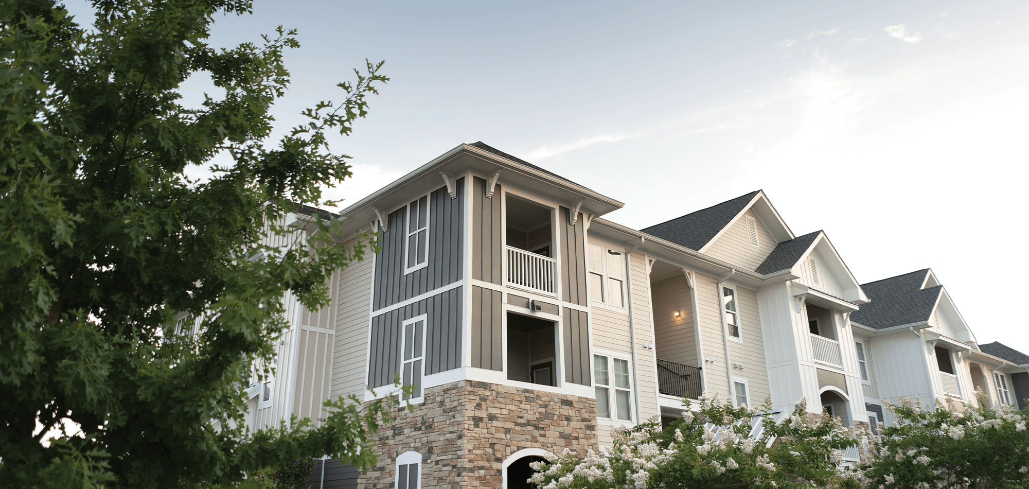 Outside view of the Morgan at Eastchase showing the exterior siding and stonework